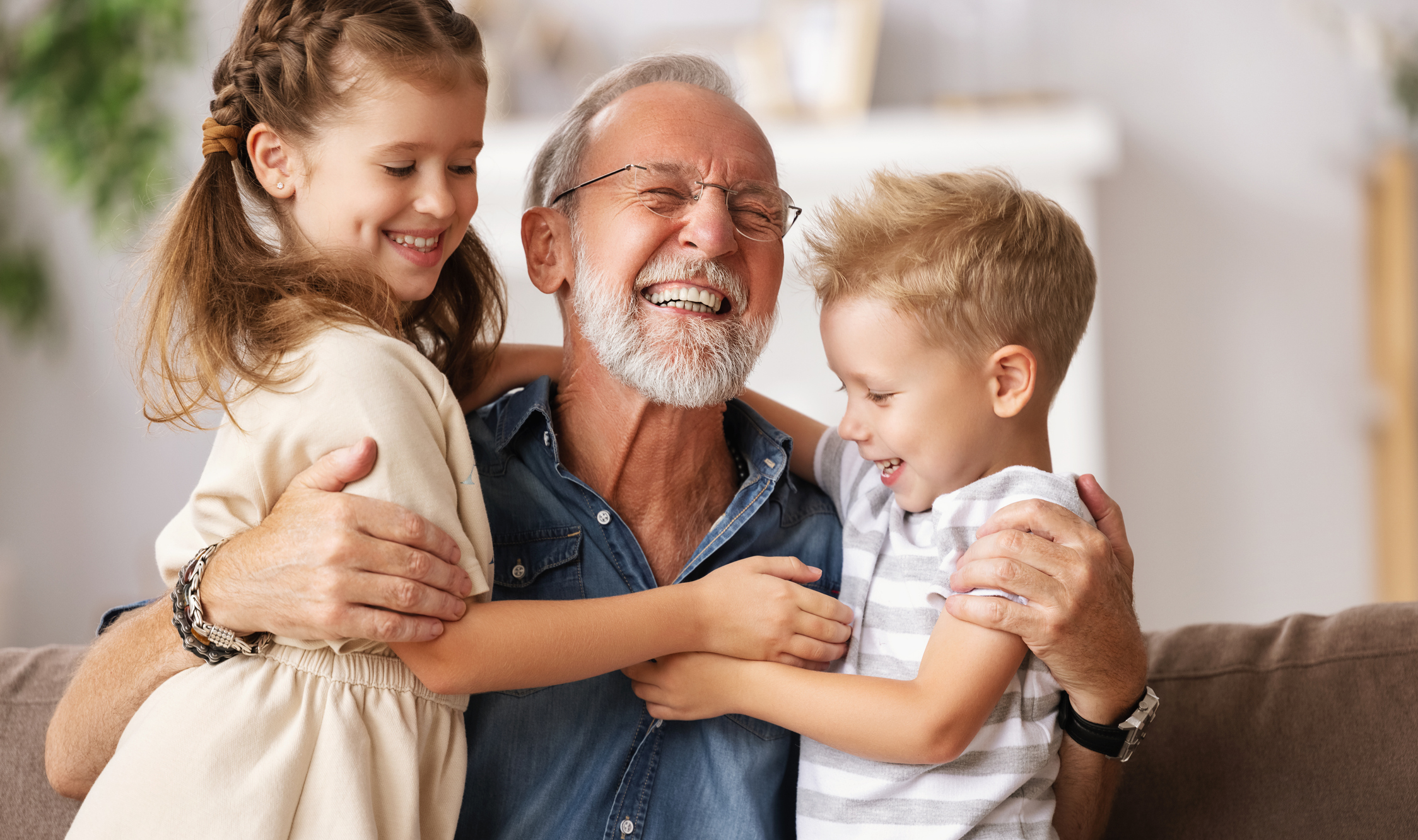 Happy grandfather with grandchildren.